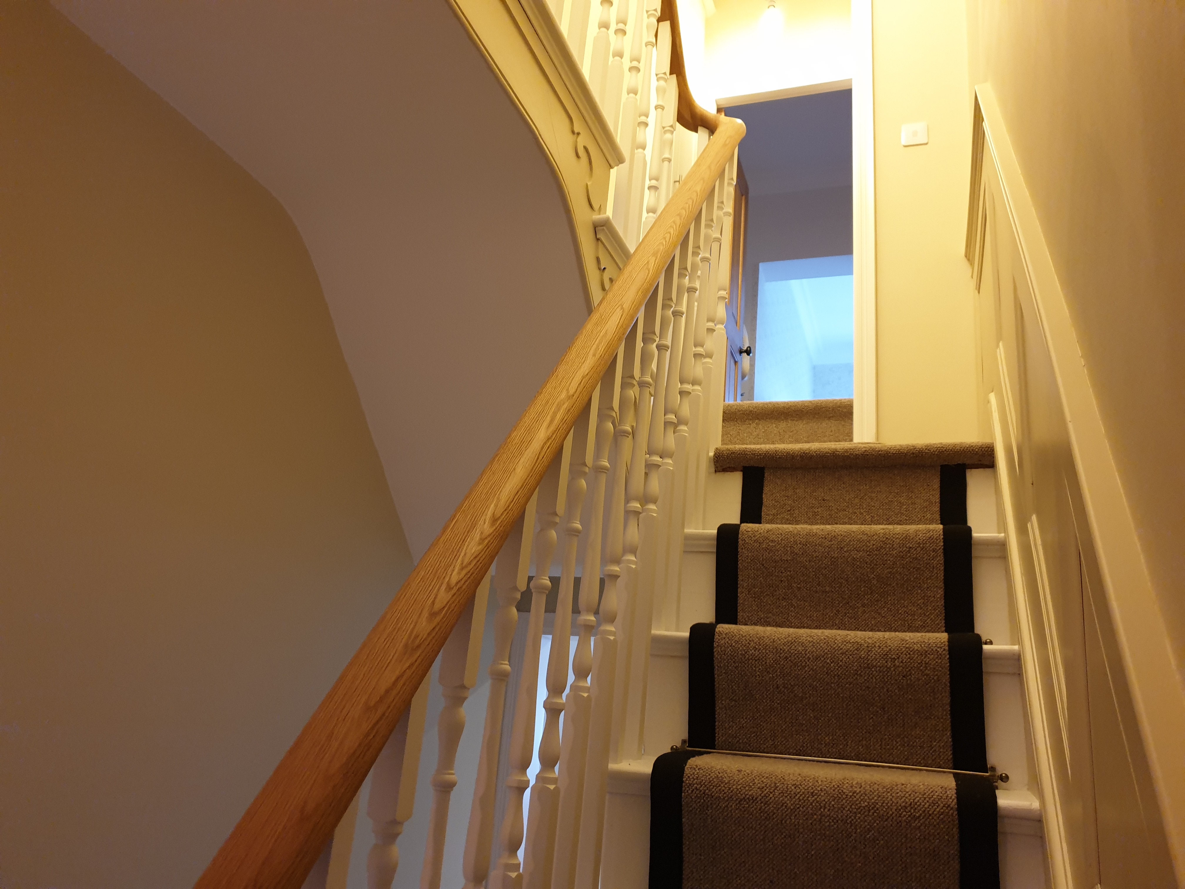 looking up at a wreathing handrail